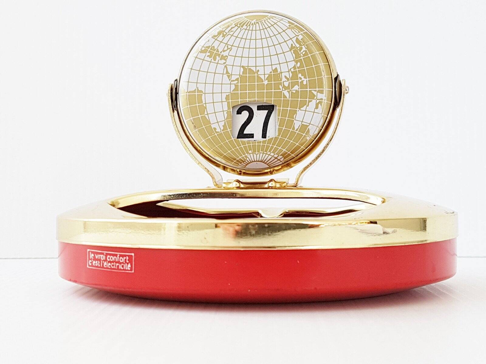 Vintage 1950s brass gold-plated globe perpetual calendar ashtray.