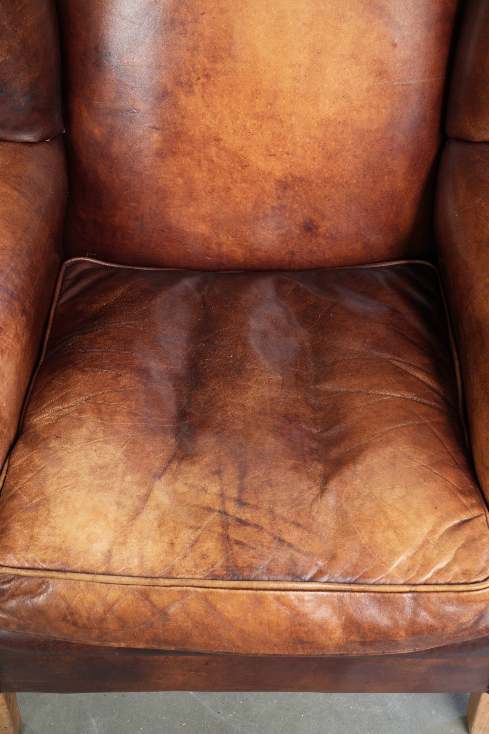 Comfortable cowhide wingback armchair in English style