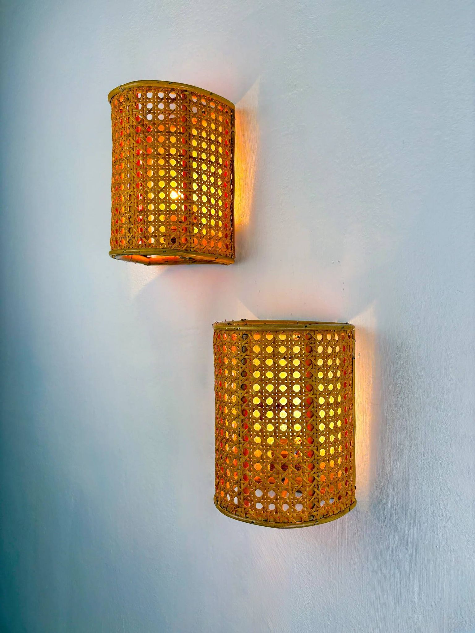 Pair of mid-century woven wicker & rattan wall sconces – Italy 1960s