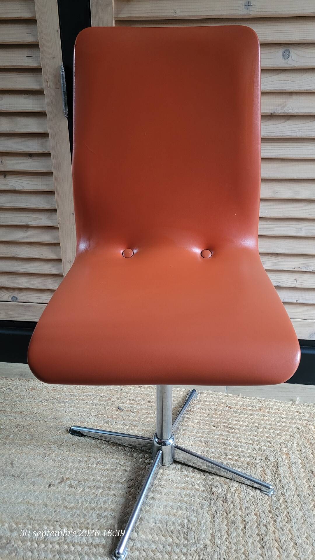2 orange faux leather swivel chairs