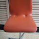 2 orange faux leather swivel chairs