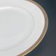 Round porcelain dish from Limoges golden tower