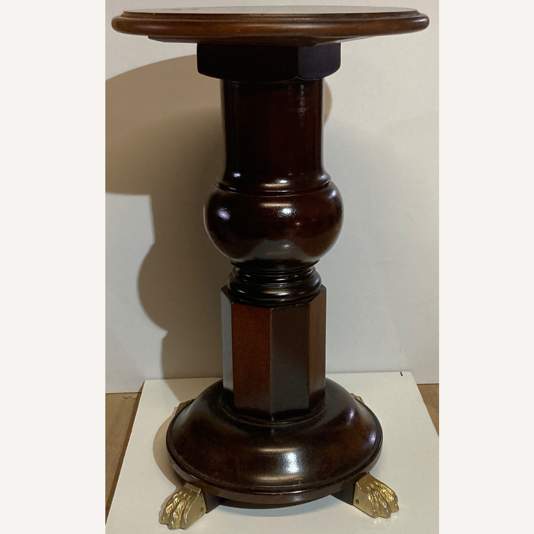 Vintage mahogany pedestal or side table with brass claw feet