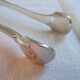 Christofle Silver-plated metal sugar tongs with crossed ribbon bow design