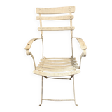 White armchair with wooden slats and metal structure