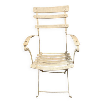 White armchair with wooden slats and metal structure