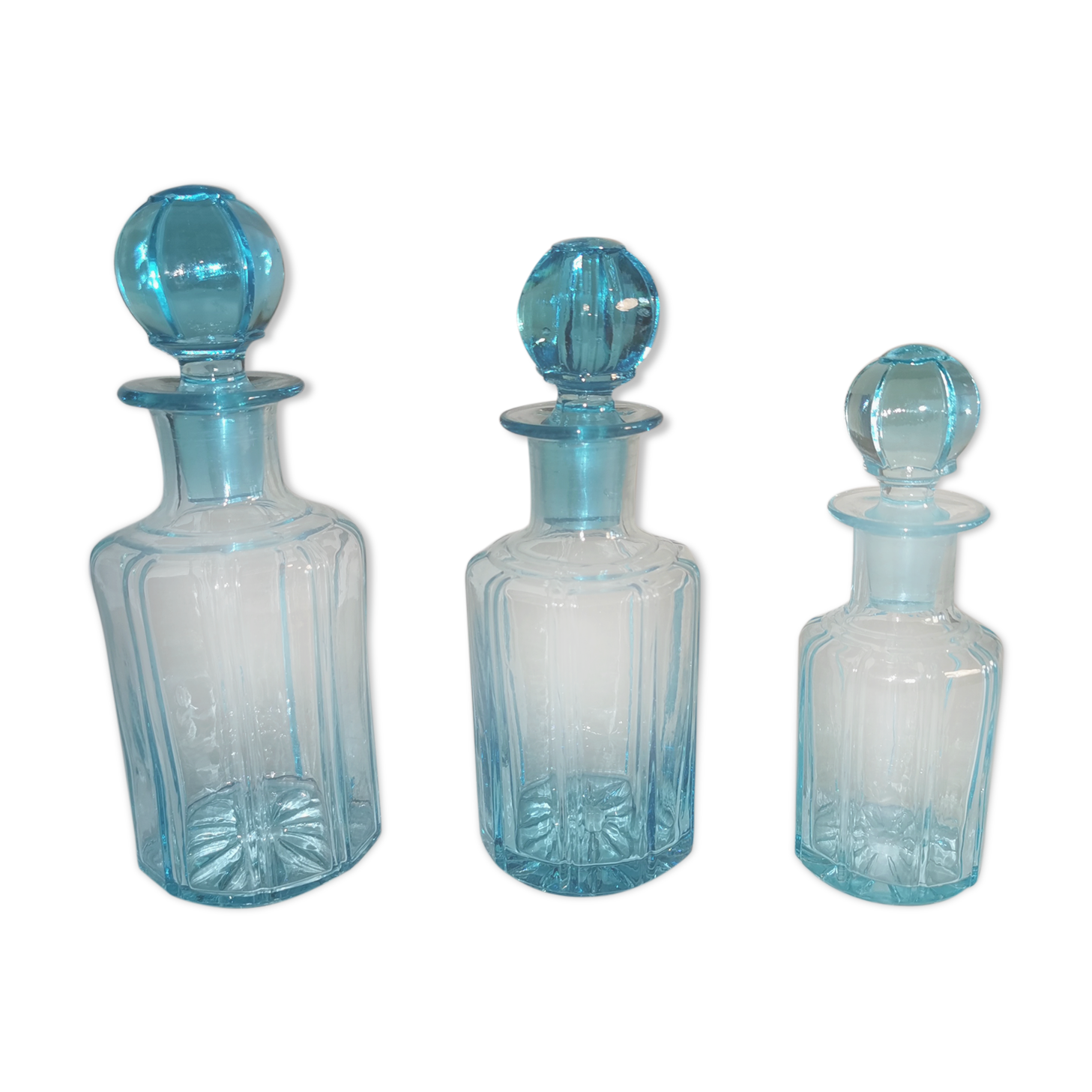Trilogy of old blue glass bottles