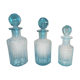 Trilogy of old blue glass bottles