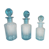 Trilogy of old blue glass bottles