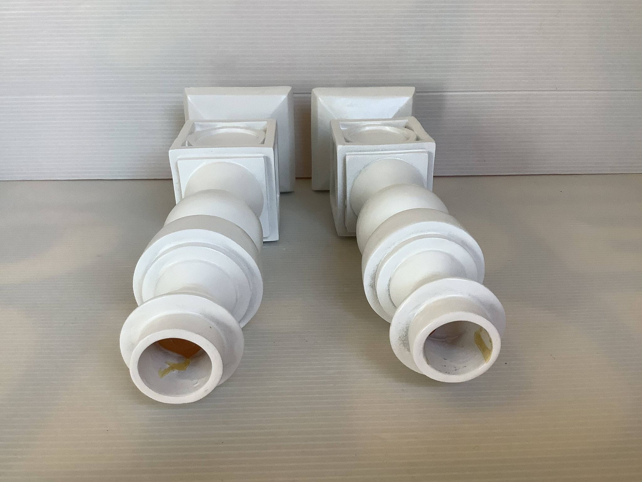 Pair of white resin candle holders