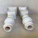 Pair of white resin candle holders