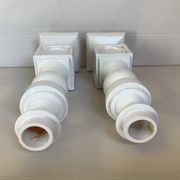 Pair of white resin candle holders