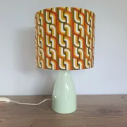 Seventies spirit lamp with geometric orange/green lampshade.