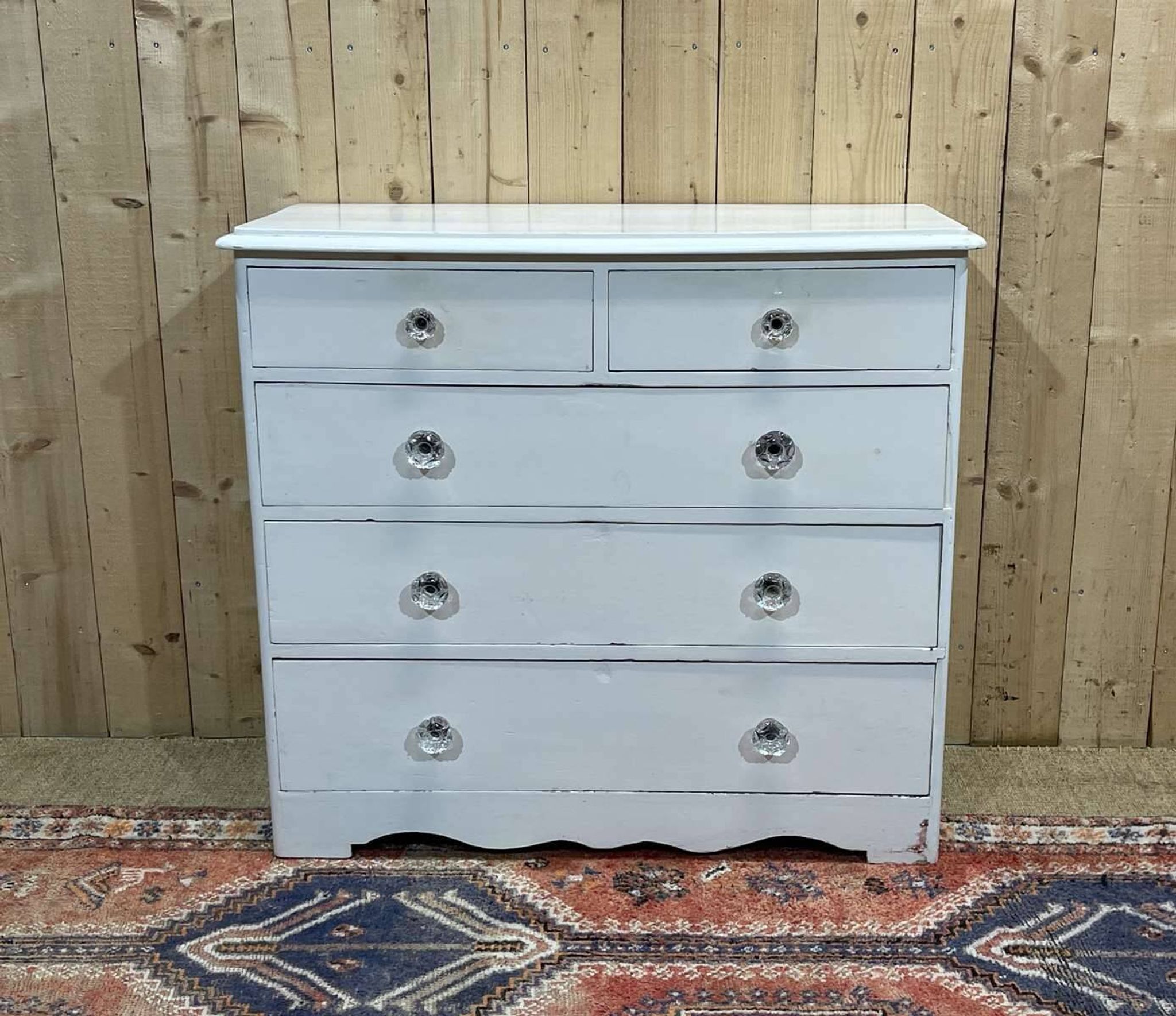 English chest of drawers painted in fir with glass knobs, 19th century