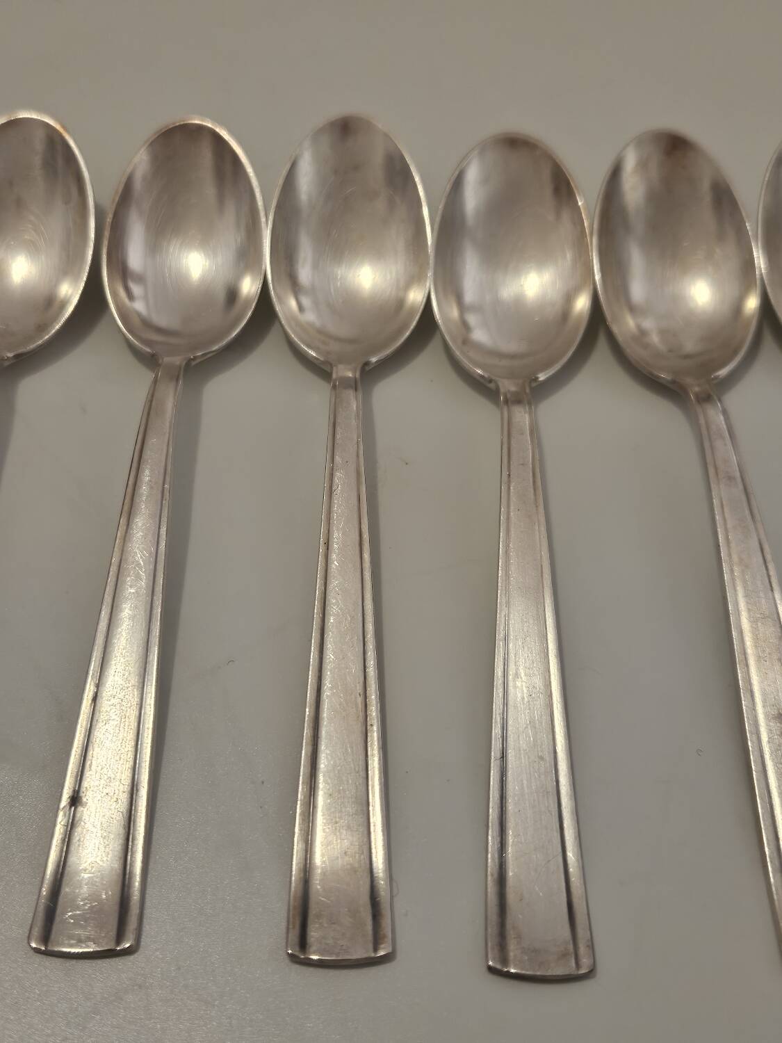 Set of silver dessert spoons and forks