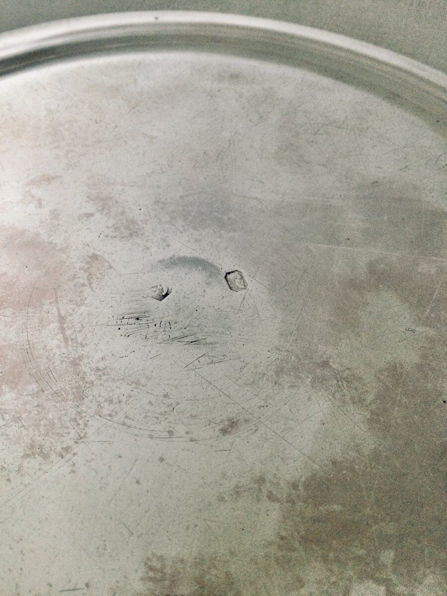 Solid silver dish with old man