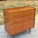 Vintage walnut varnished chest of drawers with 4 drawers from the 1960s.