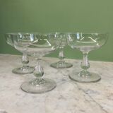 4 Baccarat crystal champagne coupes in a gondola shape.