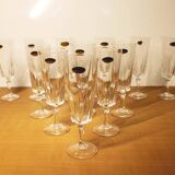 Ensemble de 12 flûtes à champagne, modèle “Versailles”, Cristal d’arques, 70’s.