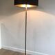 Floor lamp in black lacquered metal and brass