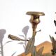 Pair of brass candlesticks with plant decoration
