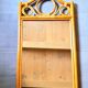 Curved wooden mirror and rattan
