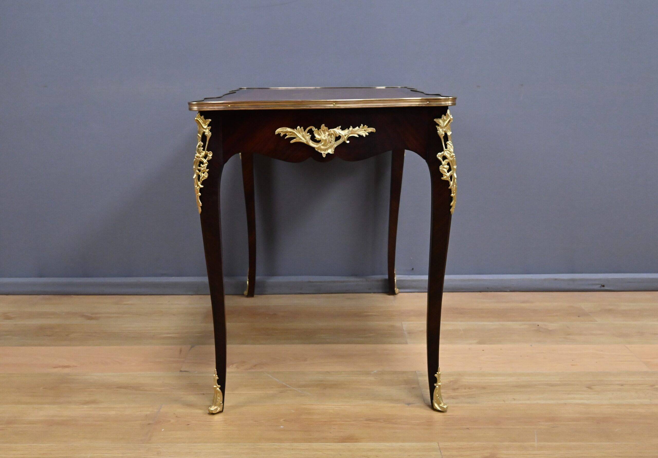 Rosewood, mahogany, and rosewood desk-table, Louis XV style – early 20th century.