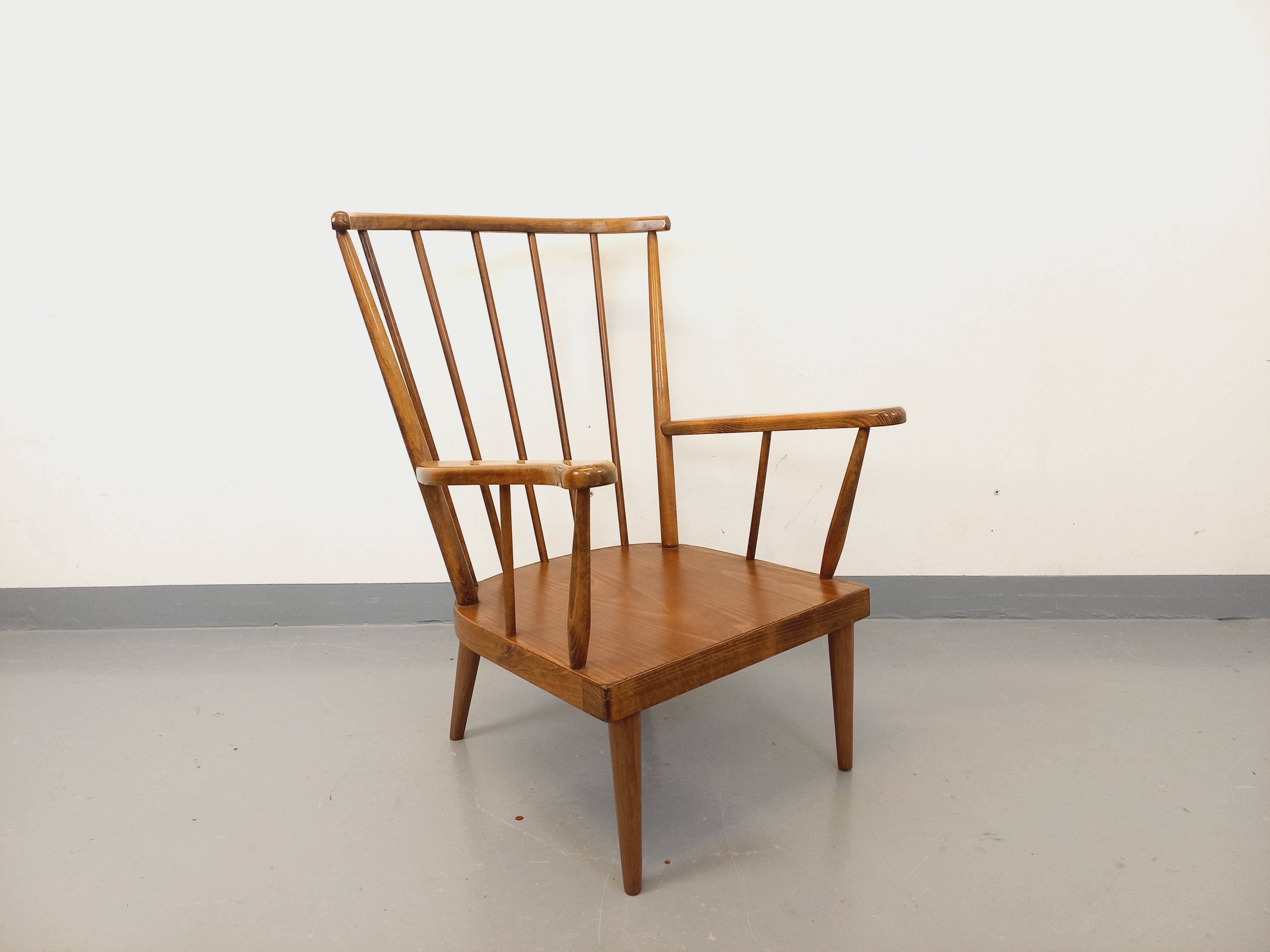 Vintage wooden armchair Baumann model Éventail from the 1960s.