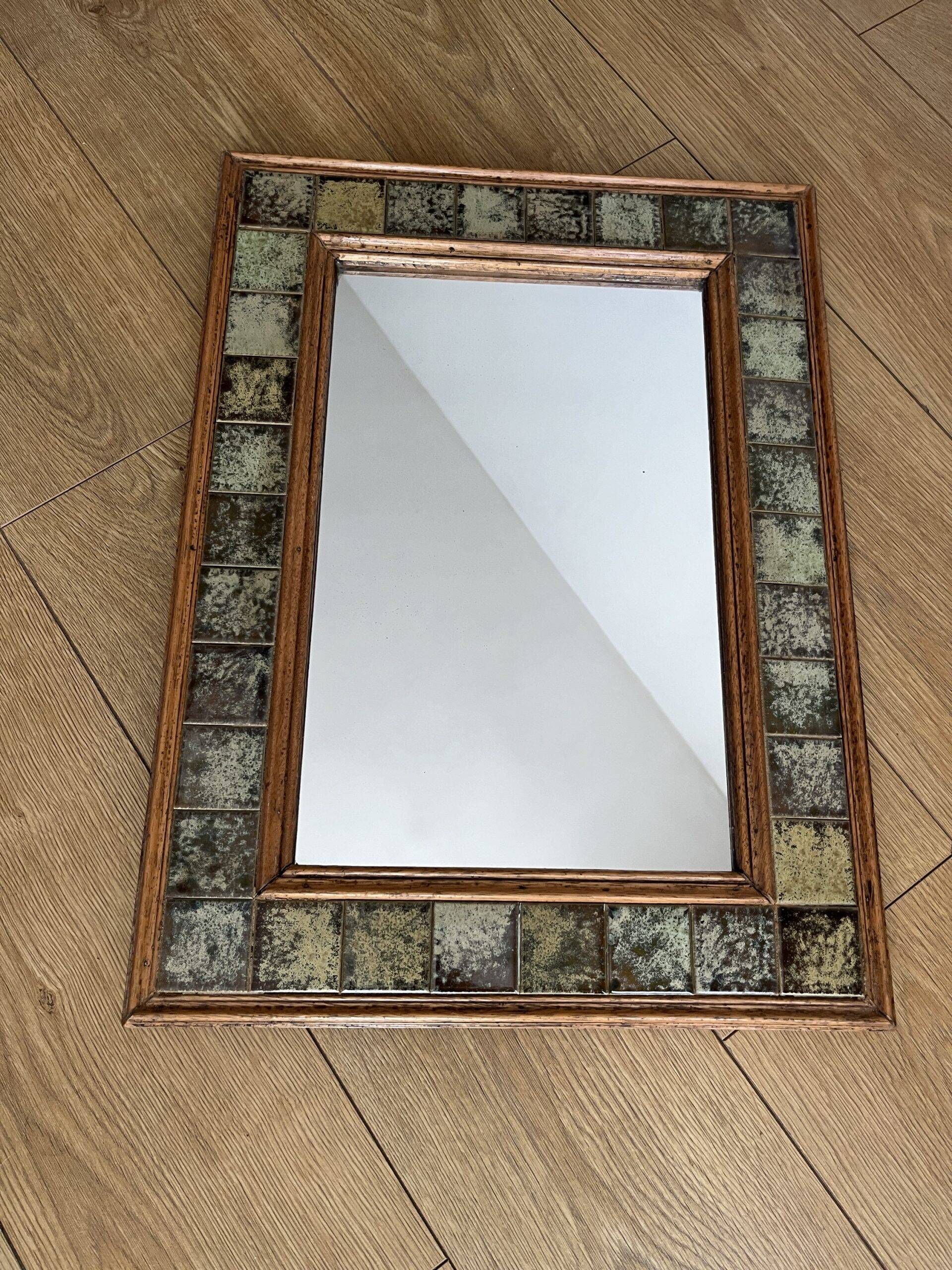 Vintage wall mirror in wood and ceramic tiles