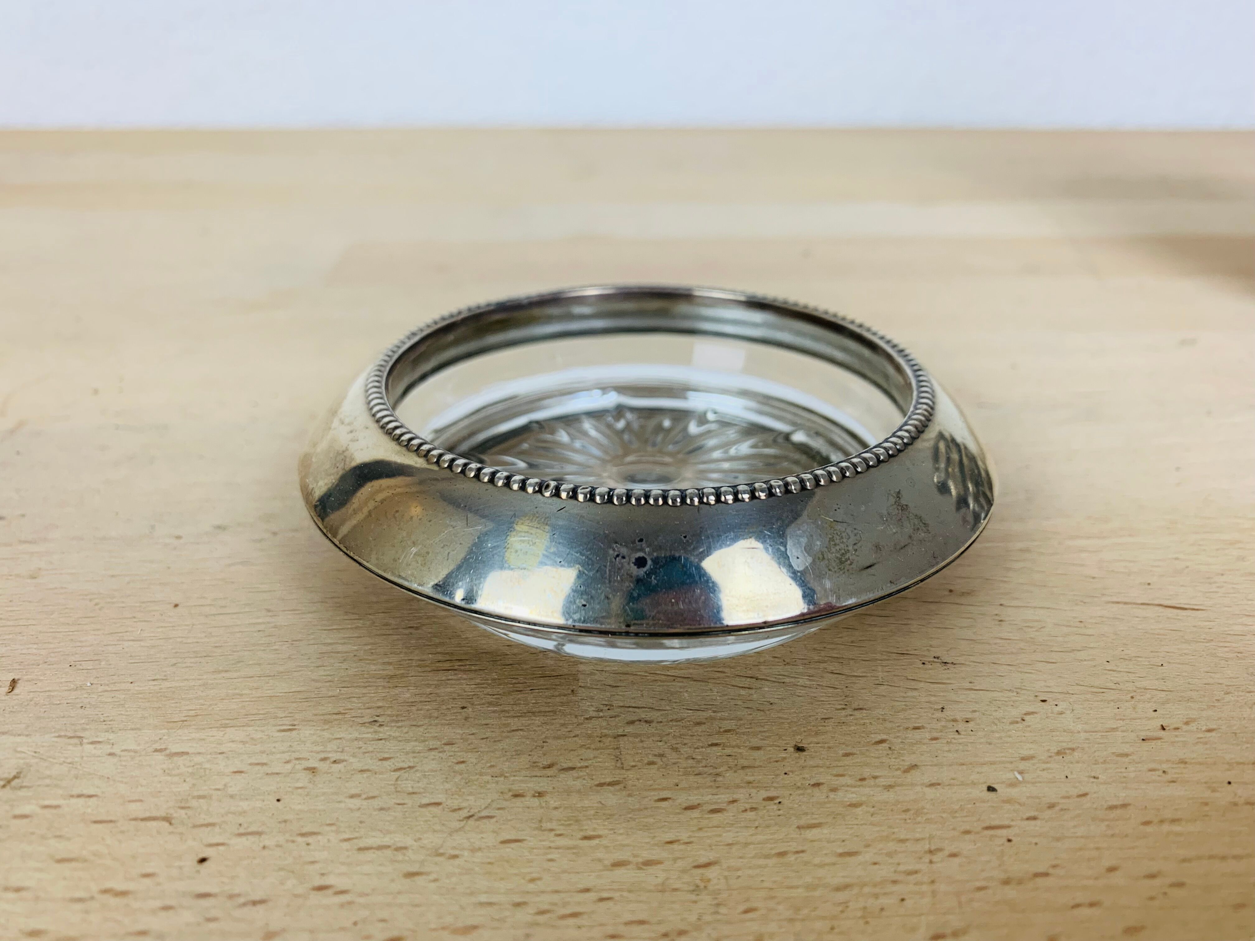 5 silver metal coasters Frank Whiting & Co