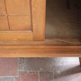 Vintage wooden wardrobe with sliding doors.