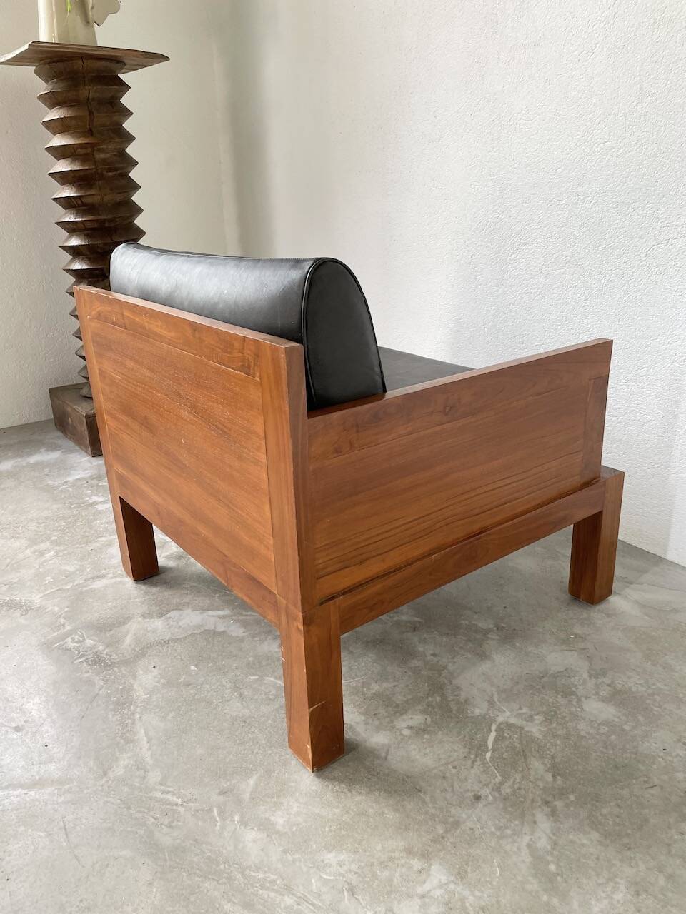 Modernist armchair in exotic wood and leather