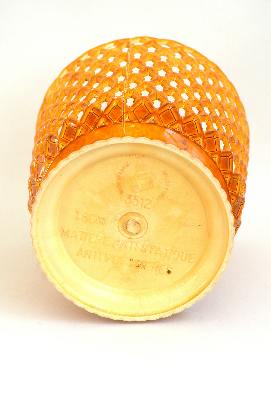 Orange openwork pot cover