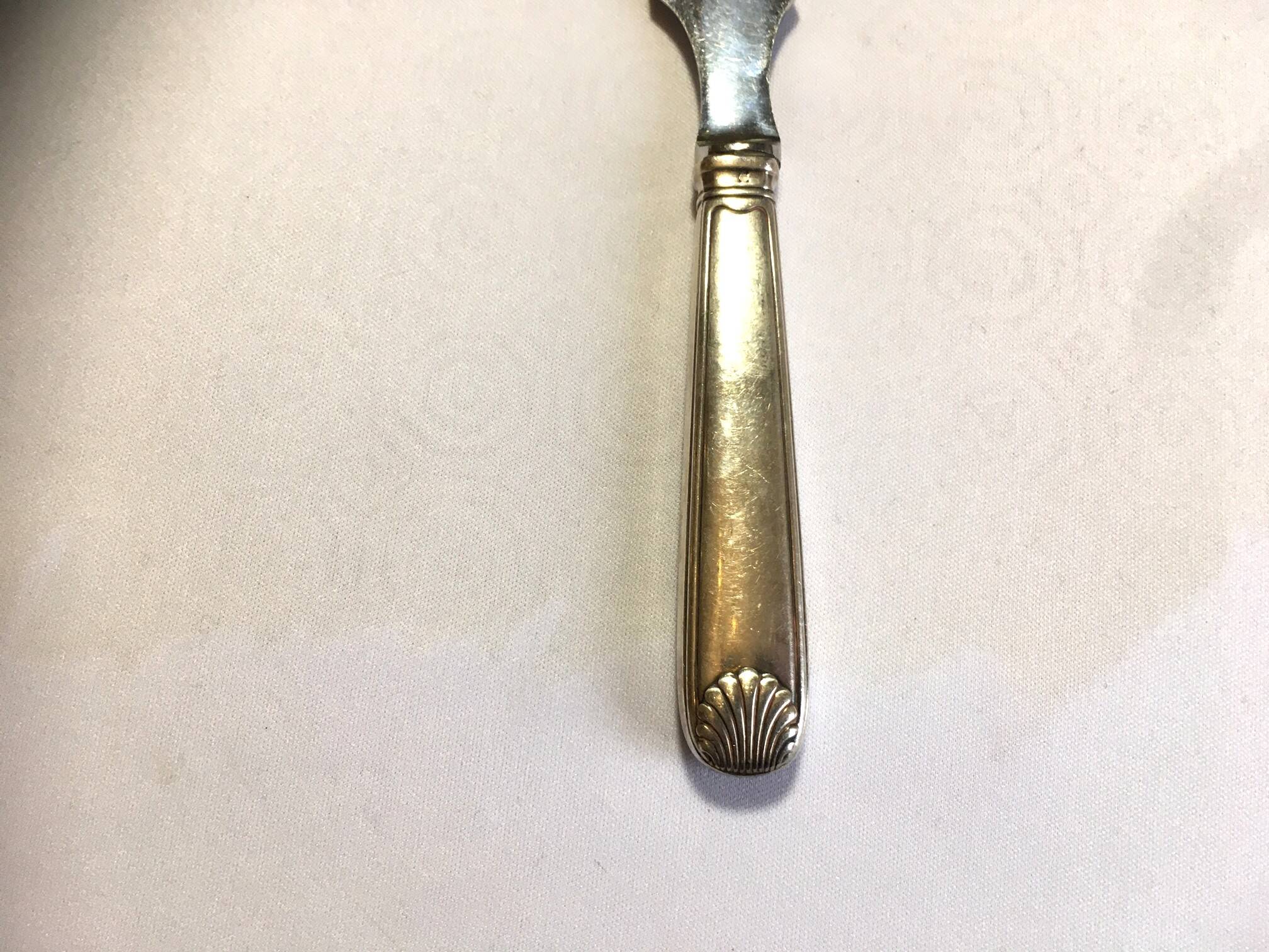 Silver metal cheese knife