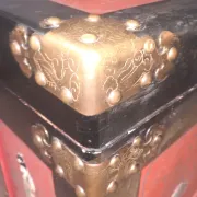 Red lacquered wooden mallet from the Far East.