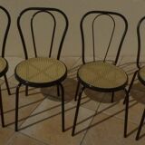 4 Chaises bistrot en métal noir et assise cannage plastique