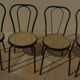4 Black metal bistro chairs with plastic cane seat