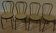 4 Black metal bistro chairs with plastic cane seat