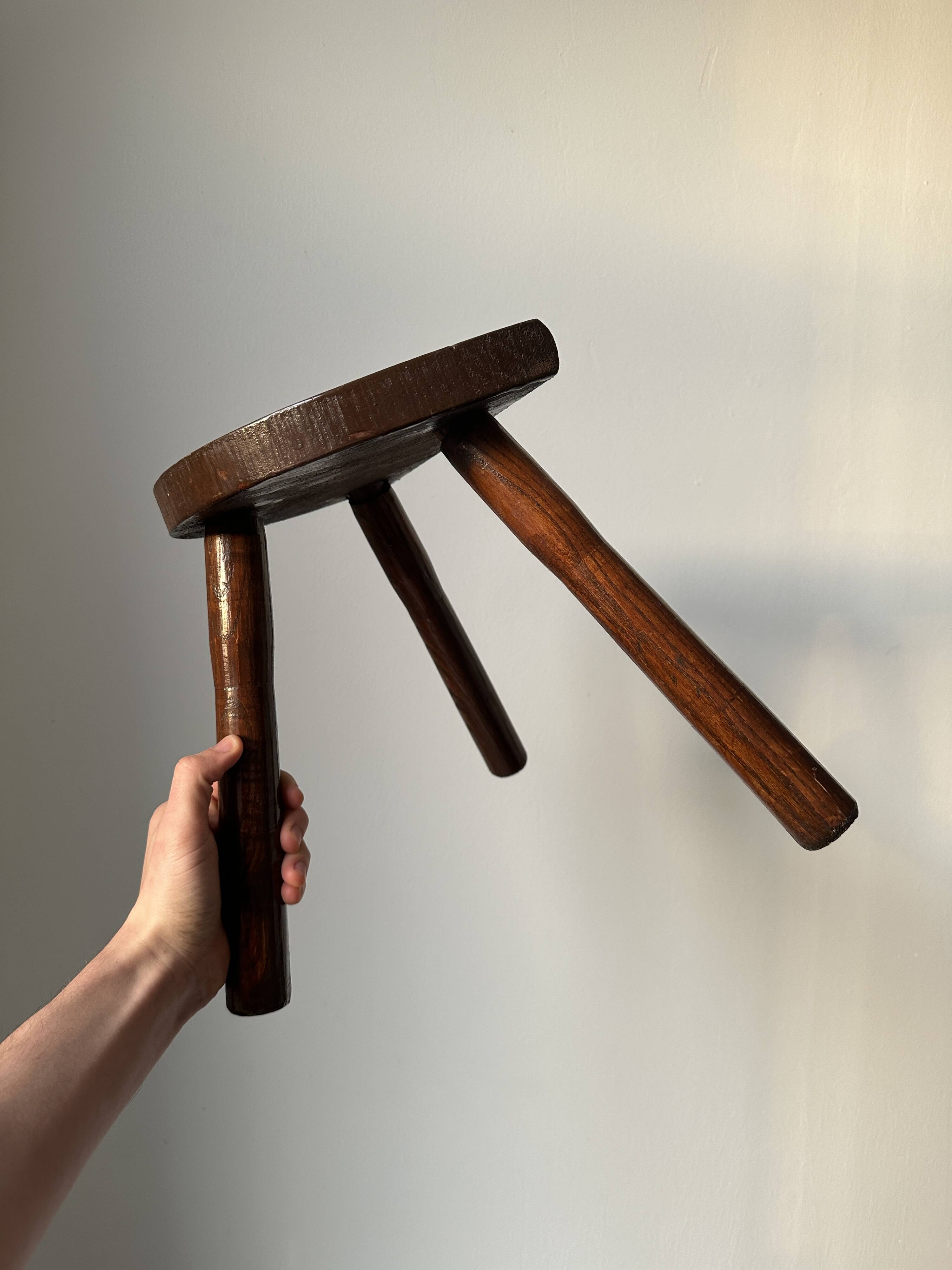 Varnished wooden stool with three legs