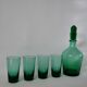 Set of a carafe and 4 designer glasses in green glass from the 70s