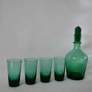 Set of a carafe and 4 designer glasses in green glass from the 70s