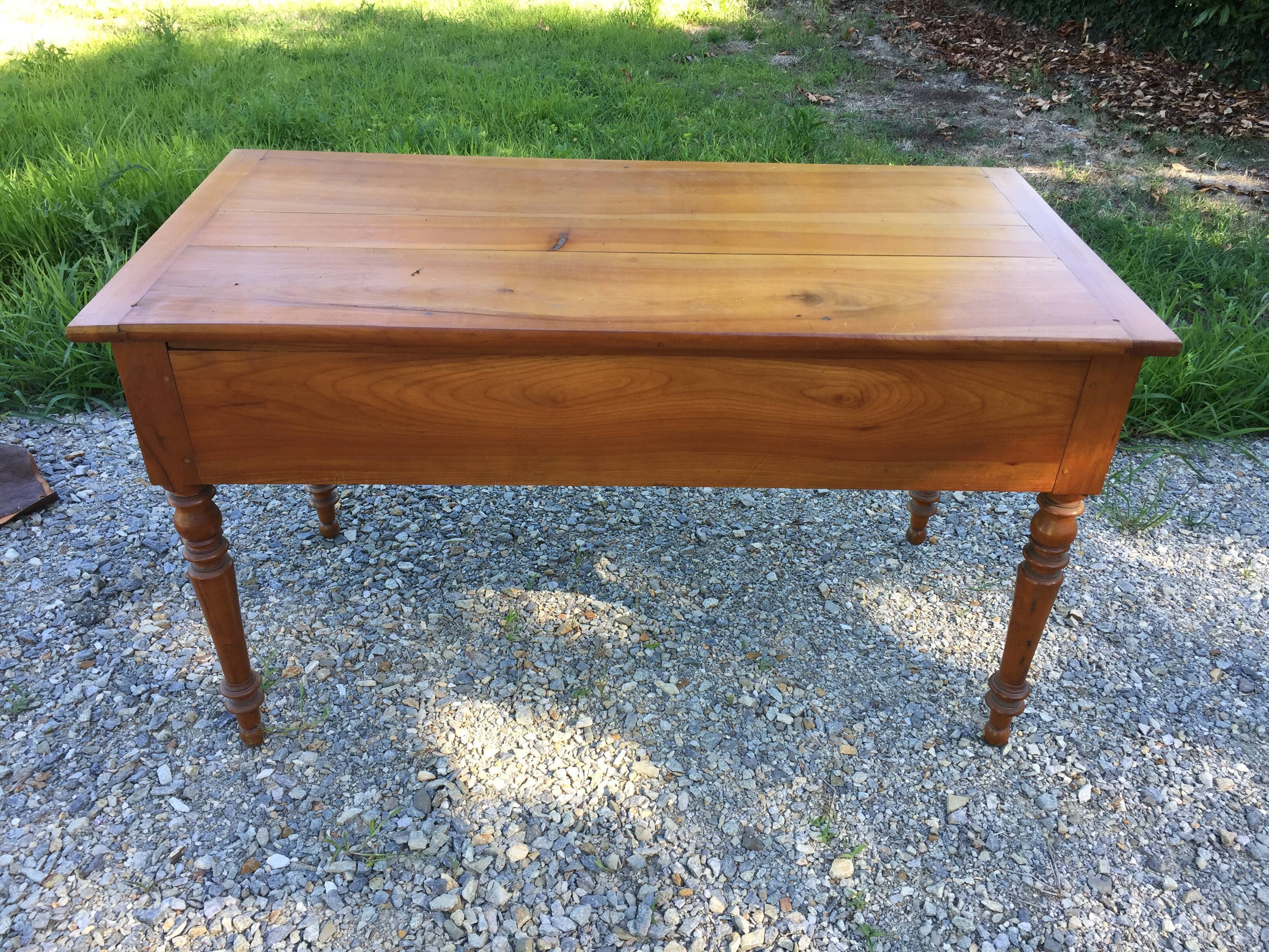 Old farmhouse table louis Philippe style in solid cherry with turned feet.