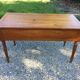 Old farmhouse table louis Philippe style in solid cherry with turned feet.