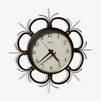 Vintage clock featured in black wrought iron