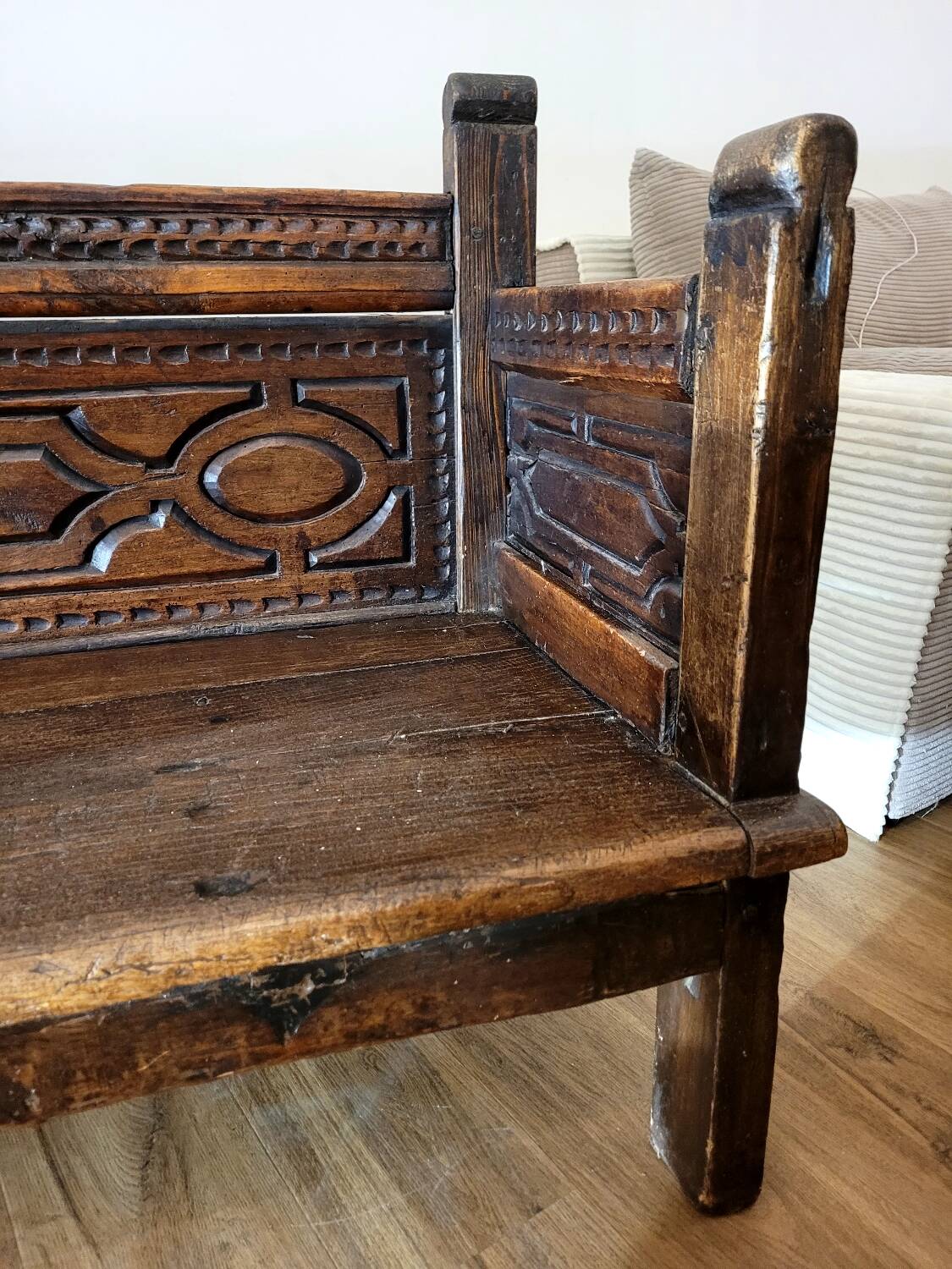 Antique carved solid wood bench from the early 20th century