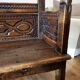 Antique carved solid wood bench from the early 20th century