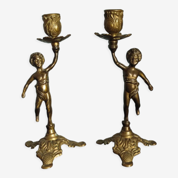 Set of two cherub cherub candlesticks in bronze