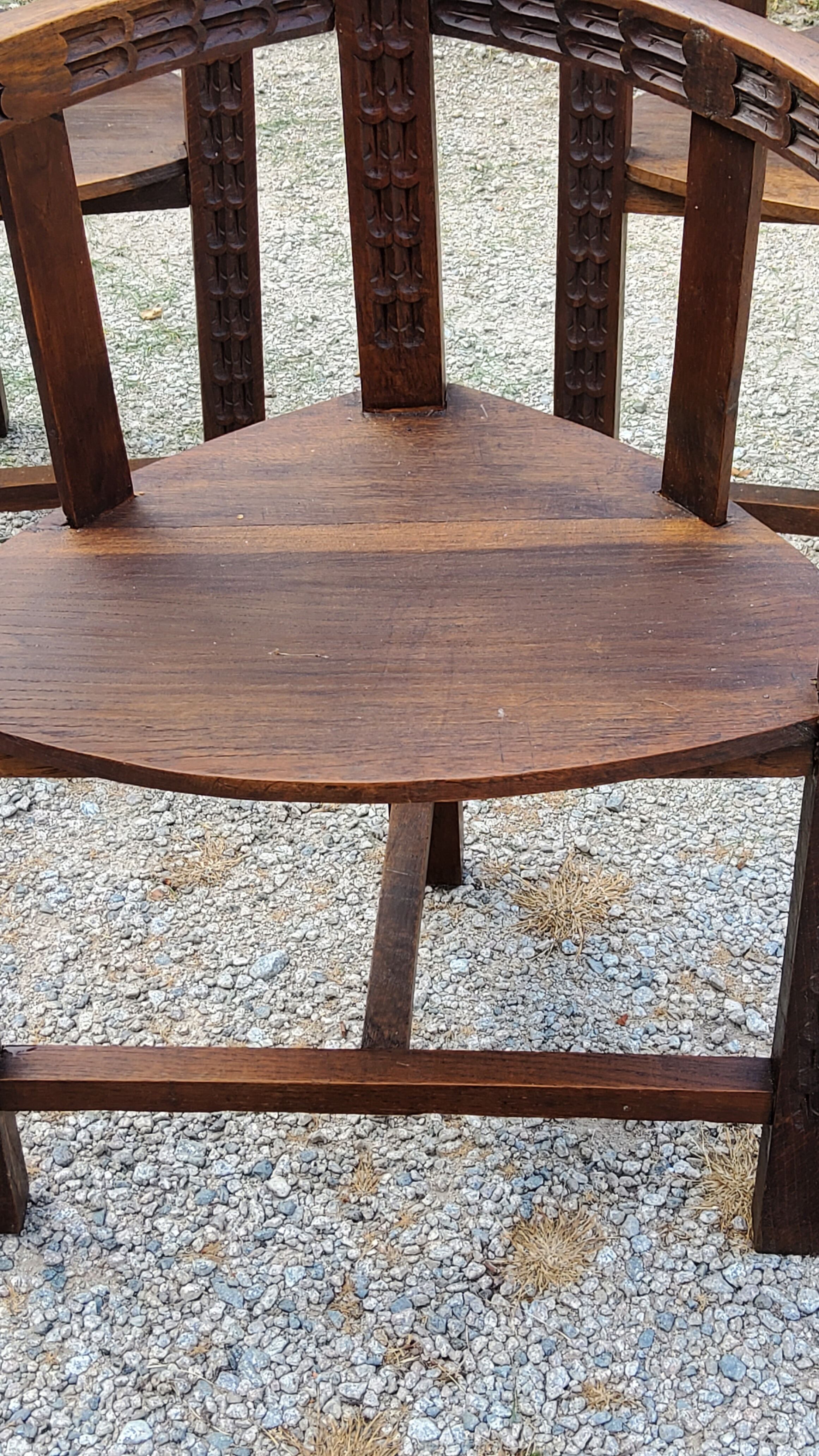 Set of three brutalist tripod armchairs in carved solid oak