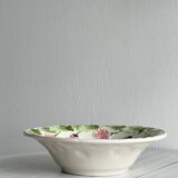 Ceramic slip dish with strawberry and flower pattern.