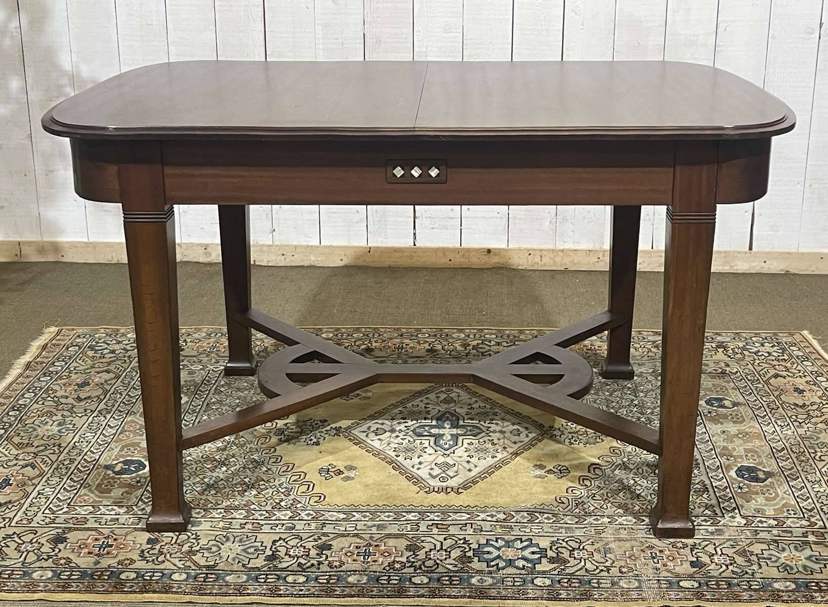 Art Nouveau dining table in mahogany in the style of Gustave Serrurier-Bovy.